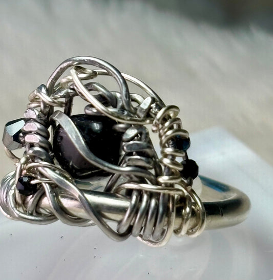 Black Onyx and Argentinian, silver ring: ￼ commanding strength